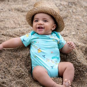 Ku'u Home O Hawai'i Onesie featuring baby boy sitting on sand