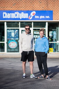 Charm City Run CEO & Founder Josh Levinson and his wife Kara Levinson in front of the flagship Charm City Run Timonium location.