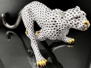 Herend Cheetah figurine in the Black Fishnet pattern, the first edition mark, and measuring 14 ¼ inches long by 6 inches wide, in like-new condition (est. $3,000-$5,000).