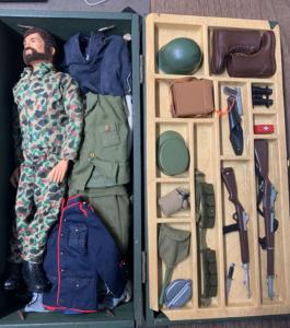 Circa 1964-1970 GI Joe Land Adventurer action figure, complete with weapons tray, wooden footlocker and doll with good flocked hair and lots of uniforms (est. $250-$500).