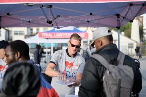 One of the LATLC volunteers, Chris, proactively helping a Los Angeles resident at the LATLC booth.