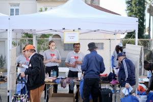 LATLC volunteers at the "Day of Dignity" event welcoming the Los Angeles community at their Clothing Store booth.