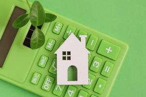 Green Calculator, white Home, Leaf on green background.