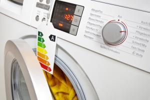 Modern washing machine with eco-label, which shows the efficiency class A