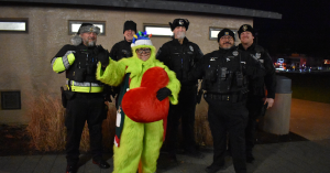 Gresham Grinch with Police at Holiday Light Cruise