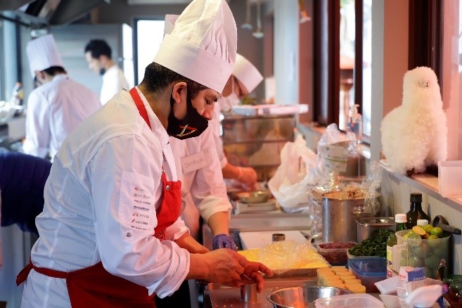 Chef cooking a meal in a kitchen