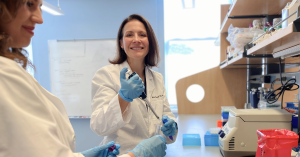 Scientist Anna Patrick, MD, PhD, pipes into a test tube in her lab