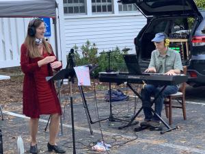Kathryn and Bryce Denney, conducting one of many of their "driveway choirs."