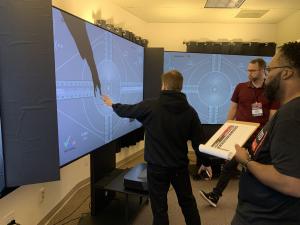 Laser TV Showdown judges comparing the differences between UST projectors side by side