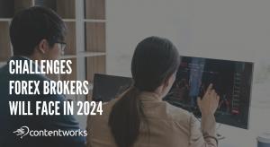 Two business colleagues (male and female) studying a forex chart on a computer screen.