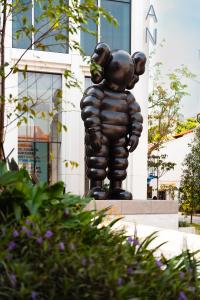WHAT PARTY’ by KAWS (2023), a 6-metre bronze sculpture at the new Mondrian Hotel in Singapore.