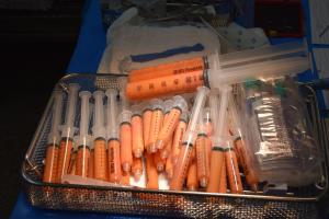 A tray filled with lots of syringes ready to use in fat grafting procedure.