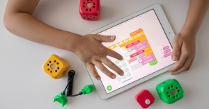 Child hands use tablet for math-related games