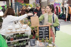 Shopper makes purchase at the 2022 Kringle Market