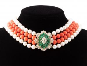 Cartier coral, pearl and 18kt gold quadruple-strand necklace from 1976 with two strands of spherical orange red coral beads flanked by two strands of white bodied cultured pearls (est. $10,000-$15,000).
