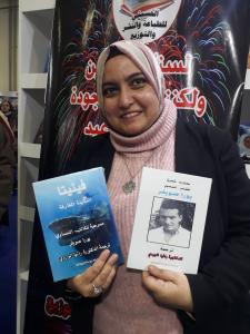 Rania Elwardy with the two translations of Soyfer in Arabic in her hands at the 53. Cairo book fair