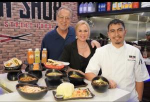 Mark Brezinski, Susan Missimo, and Josh Garcia stand at the Banh Shop counter and showcase some of the brand's most popular dishes.