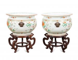 Pair of large Chinese Export famille rose enameled porcelain jardinieres, 18th century, having lion mask handles, decorated with blooming florals and birds and interiors decorated with koi ($27,225).