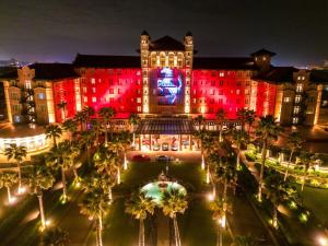 NOV 24 FRIDAY-GRAND GALVEZ INAUGURATES CHRISTMAS TRADITION-LIGHTING 27 PALM TREES ON THE DRIVEWAY AND  50-FOOT-TALL GOBO