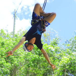 man on a zipline at Selvatica Cancun Riviera Maya