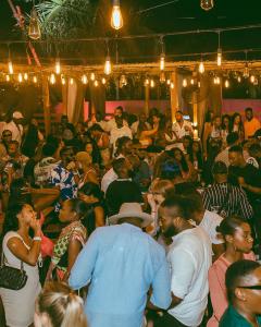 Image of party goers at afro nightlife cocktail bar Bloom Bar in Accra, Ghana