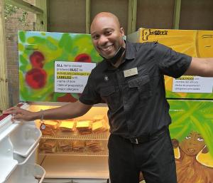 Terrence Poplar, Resident Experience Specialist, drops off sandwiches at the Upper East Side Community Fridge, operated by Central Synagogue, Grassroots Grocery, and the NYCHA Holmes Towers Resident Association.