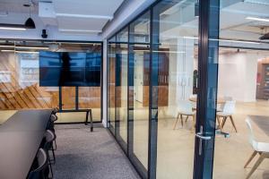 In Shawmut's New York City Office, Acousti-Clear's Stylish Design Harmoniously Fits.