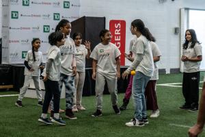 Group of students playing cricket during an OSCA school program
