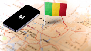 Flag of Mali, West Africa, planted on the map near Bamako. Next to it, a phone with BlackFox drilling software app.