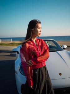 Chris Han's influential journey with Porsche not only breaks barriers but also showcases her distinctive fashion sense as she pioneers luxury influence 