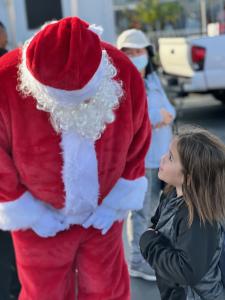 Santa Claus at LATLC's "Comfort & Joy" Event spreading the holiday spirit.