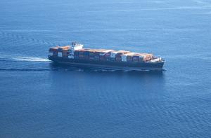 Ship in the ocean loaded with containers of goods