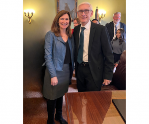 President & CEO of SecureFutures Brenda Campbell attends the signing of AB 109 by Governor Evers