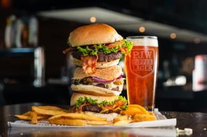 Three decadent PJ Whelihan's burgers with PJ's famous fried and signature beer, PJW Copper Lager.