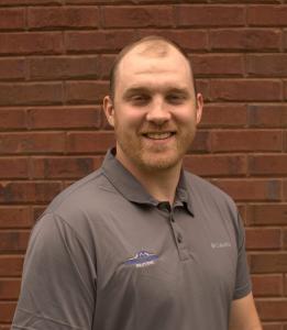 A picture of a man smiling for the camera