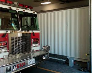 SHIPPING CONTAINER DATA CENTER INSIDE FIRE STATION WITH TANKER TRUCK