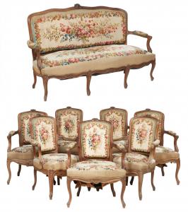 Eight-piece Louis XV style carved walnut needlepoint parlor set, including long settee and seven arm chairs (est. $800-$1,200).