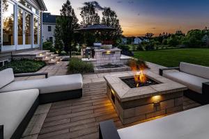Photo of a Beautifully lit Gas Fire Pit Table on an Outdoor Patio
