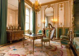Experience the elegant charm of Marie Leszczyńska's room at Versailles. Modified by Marie-Antoinette and redesigned by Richard Mique, the room showcases contemporary wood paneling and decorative motifs inspired by antiquity. Admire the exquisite furniture