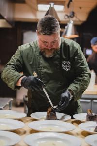 Chef Lance Lewis preparing a meal.