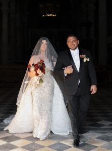 Lia Cunningham and Neo Martinez exit the cathedral at their wedding ceremony