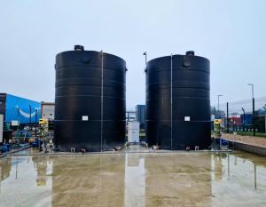 Two bulk storage tanks designed for pH balance at the Ogden Water Ltd facility. Shown head on in the facility to highlight the size and scale of them.