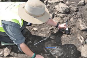 A citizen scientist is working on an active archaeology dig at Caherconnell Fort in Ireland