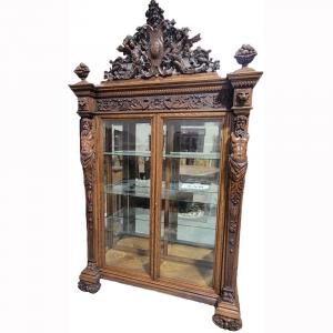 Outstanding quarter sawn oak china cabinet in the Atlas pattern by R. J. Horner, 95 inches tall by 57 inches wide, featuring elaborate scrollwork. It gaveled for $22,000 in the March 18, 2023 auction.