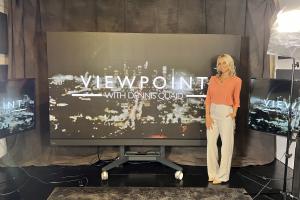 Lacey Menchen, Founder and CEO of 360 Talent Avenue with "Viewpoint with Dennis Quaid" sign