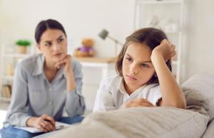 School refusal - image of reluctant child and carer