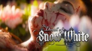 Closeup profile view of actor Sanae Loutsis as Snow White covered in blood laying in a bed of flowers with the sun on her face and the title, The Death of Snow White