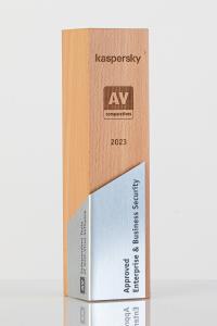 Trophy with the inscription of Kaspersky Approved Enterprise & Business Security 2023 and the logo of AV-Comparatives