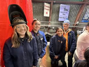 A group of 3 young girls ages 10-17 are excited to learn how to weld.