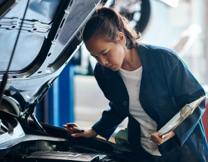 Mechanic Examining Car
